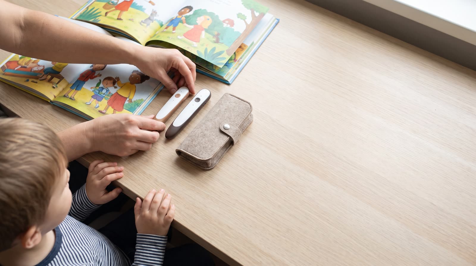 What is the difference between a brand-specific reading pen and a universal scanning pen in terms of long-term cost?