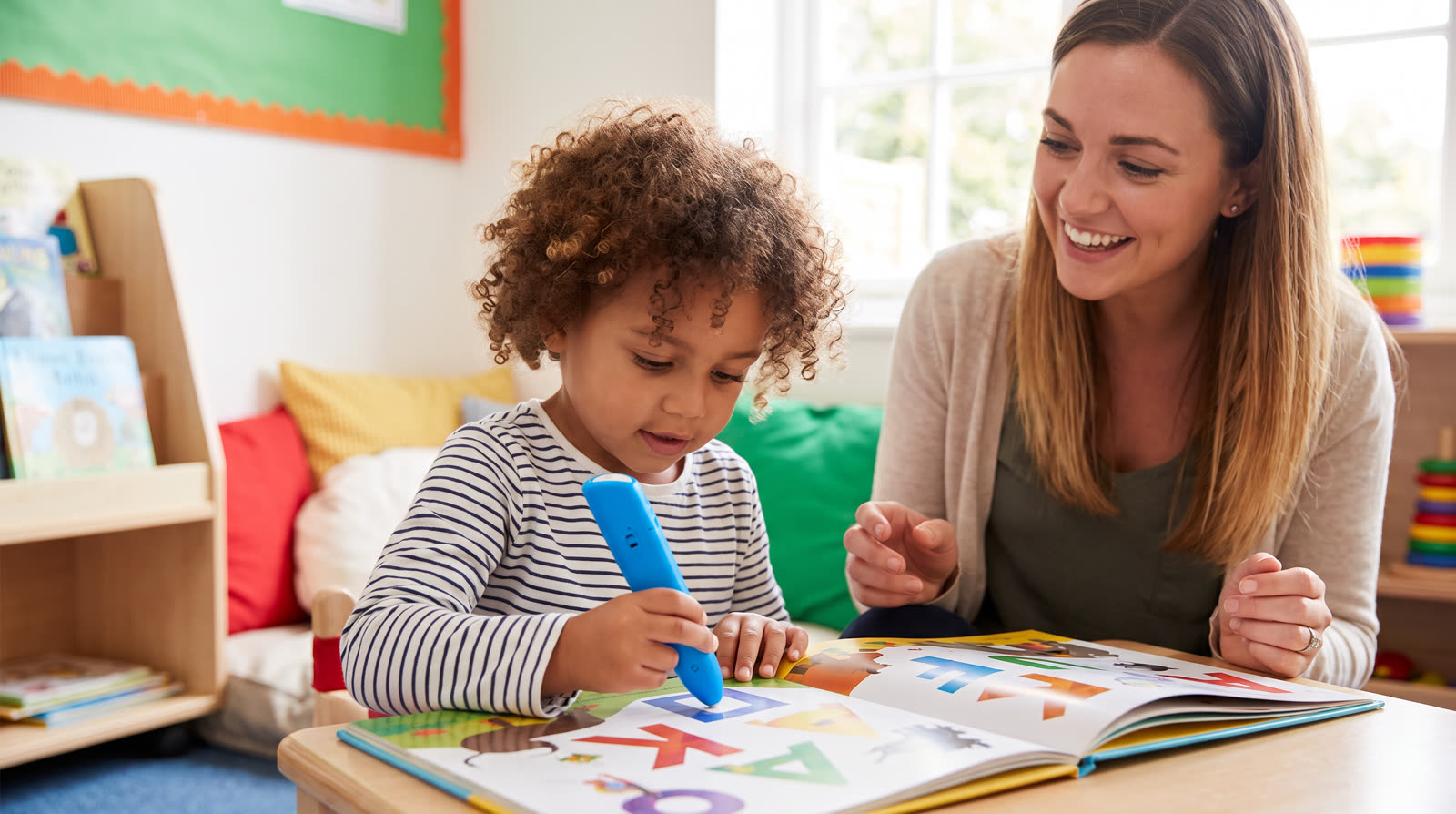Child using an unbranded reading pen and learning materials for a phonics talking pen buyer guide