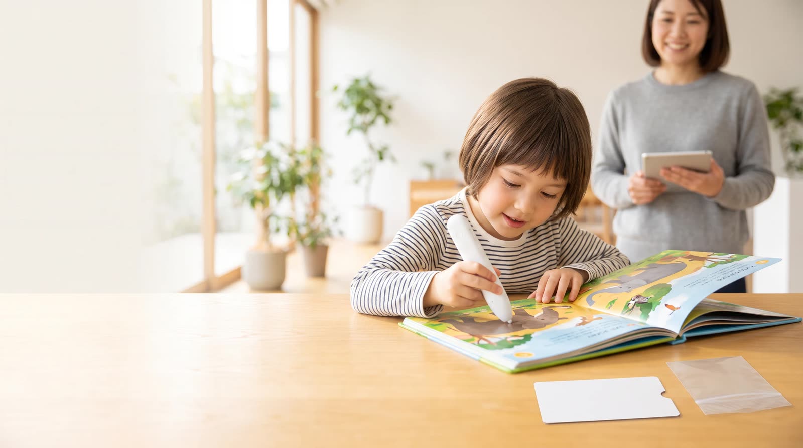Child using an unbranded reading pen with an interactive learning book during a structured factory visit